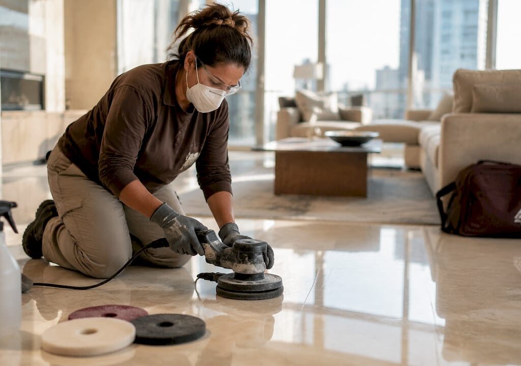 Homeowner polishing marble stone floor