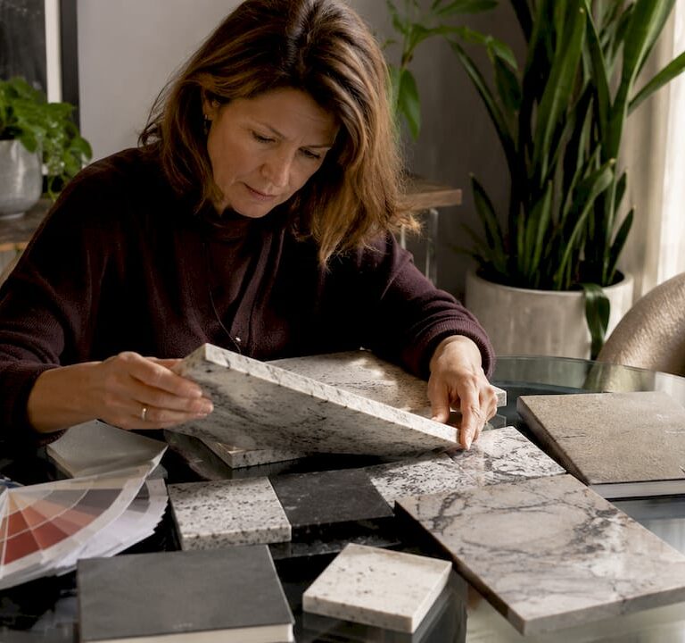 Architect comparing natural and engineered stone slabs