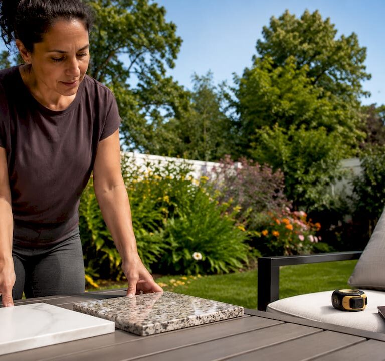 Homeowner comparing quartz and granite countertops